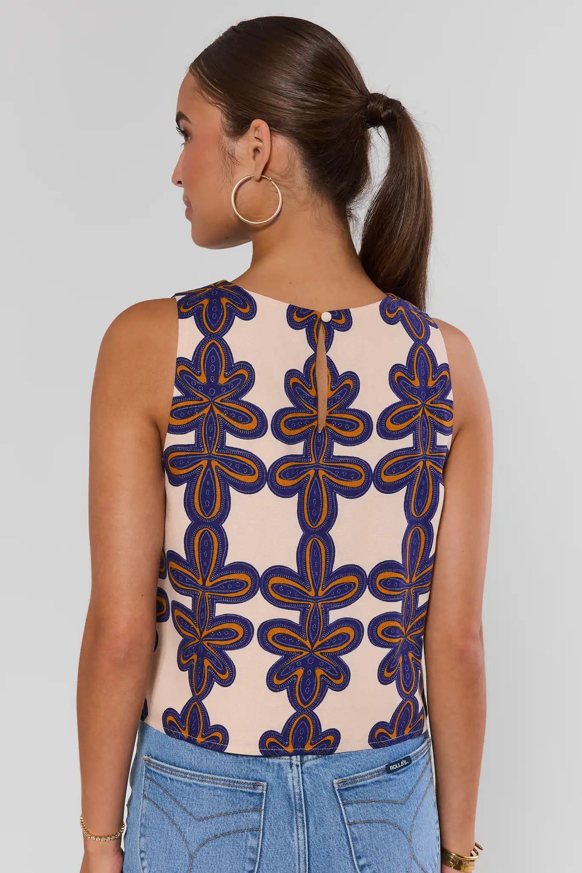 Cecilia Ivory Printed Tank Top back view showing keyhole button detail and abstract print, styled with jeans | Avara