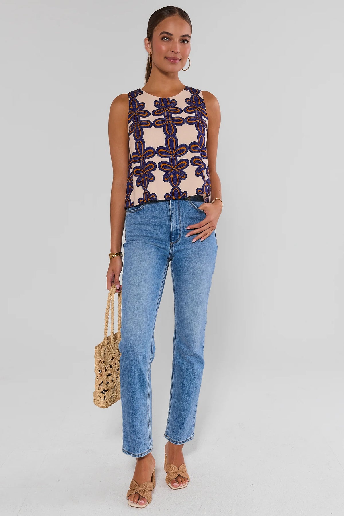 Cecilia Ivory Printed Tank Top with light wash jeans and woven straw bag, full-length front view | Avara