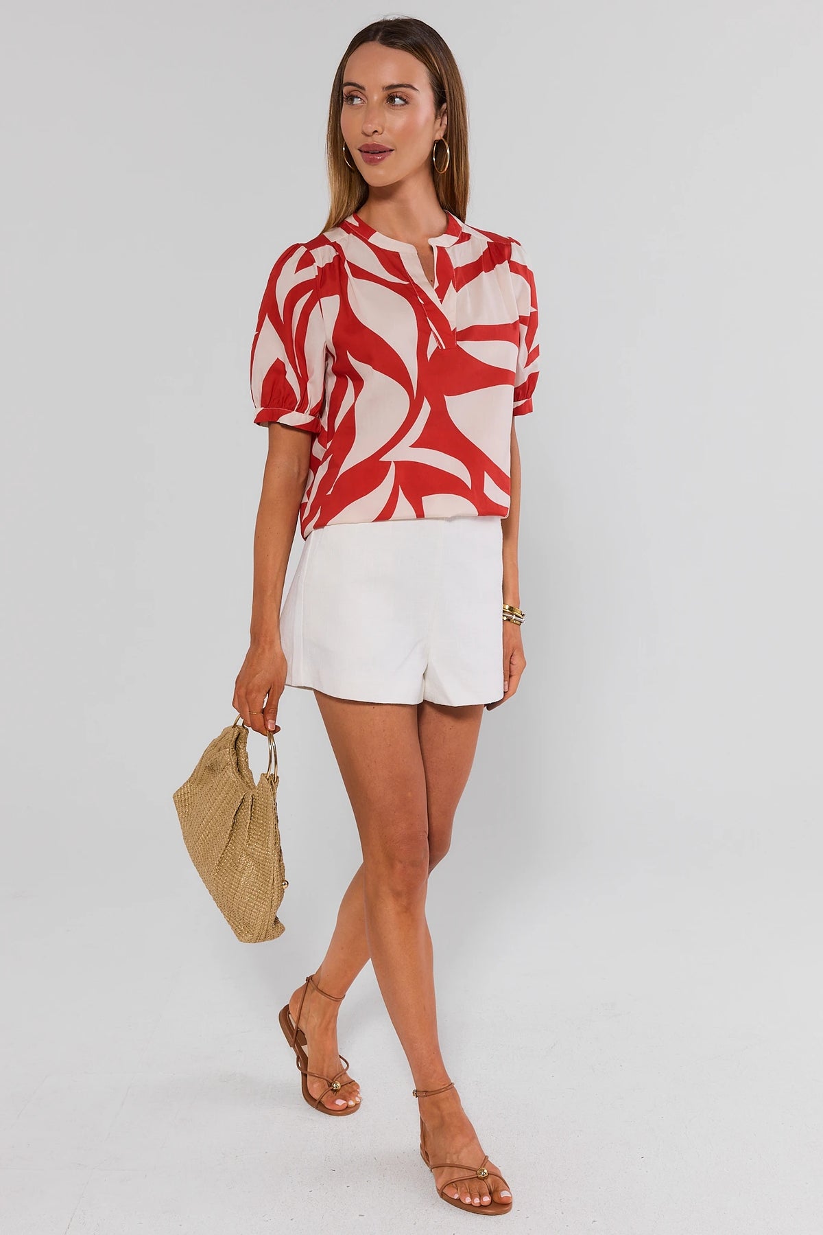 Jess Red Printed Puff Sleeve Top with white shorts and woven bag, styled summer look on model | Avara