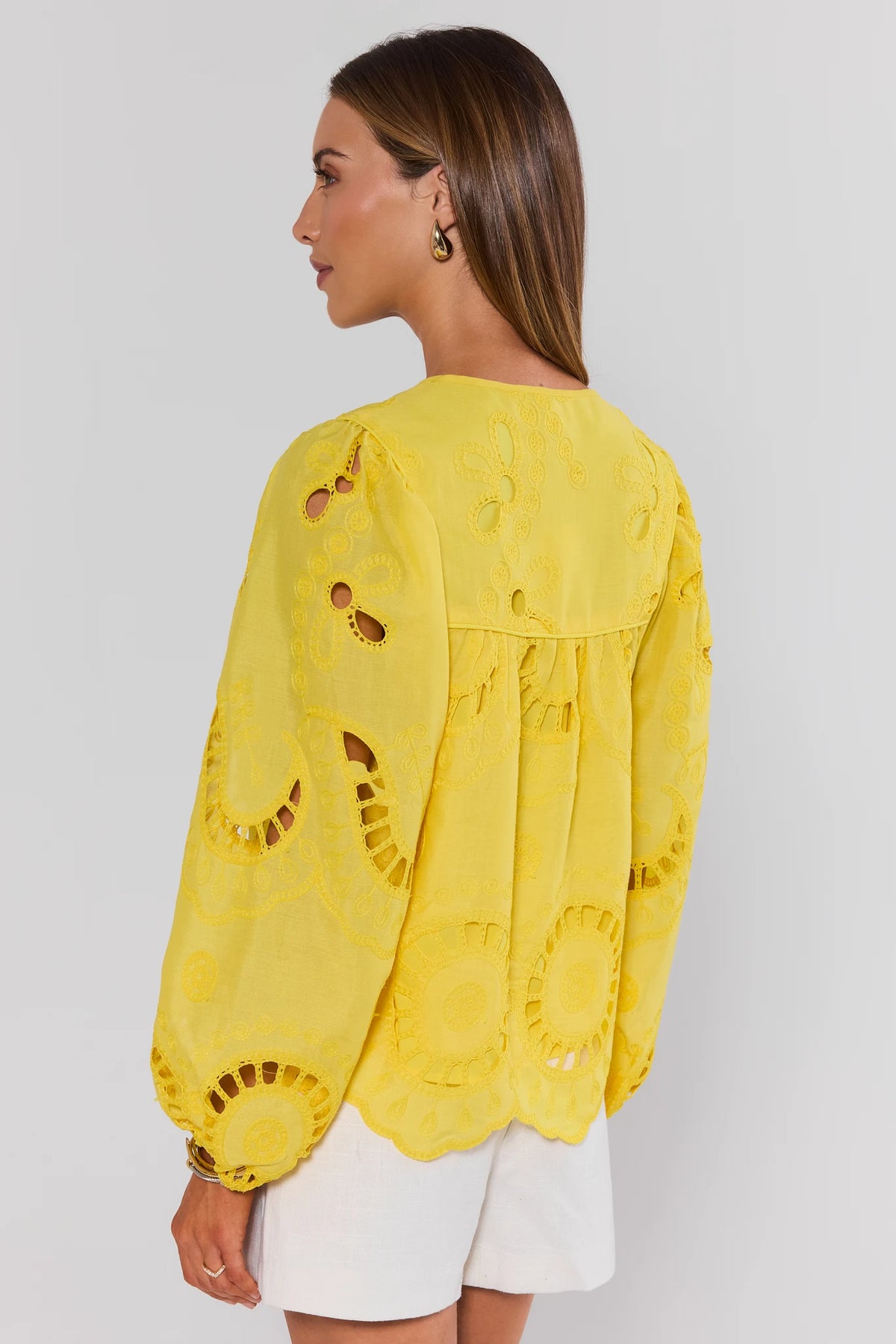 Yellow eyelet top back view showing allover cutwork embroidery and scalloped hem - Back View | Avara