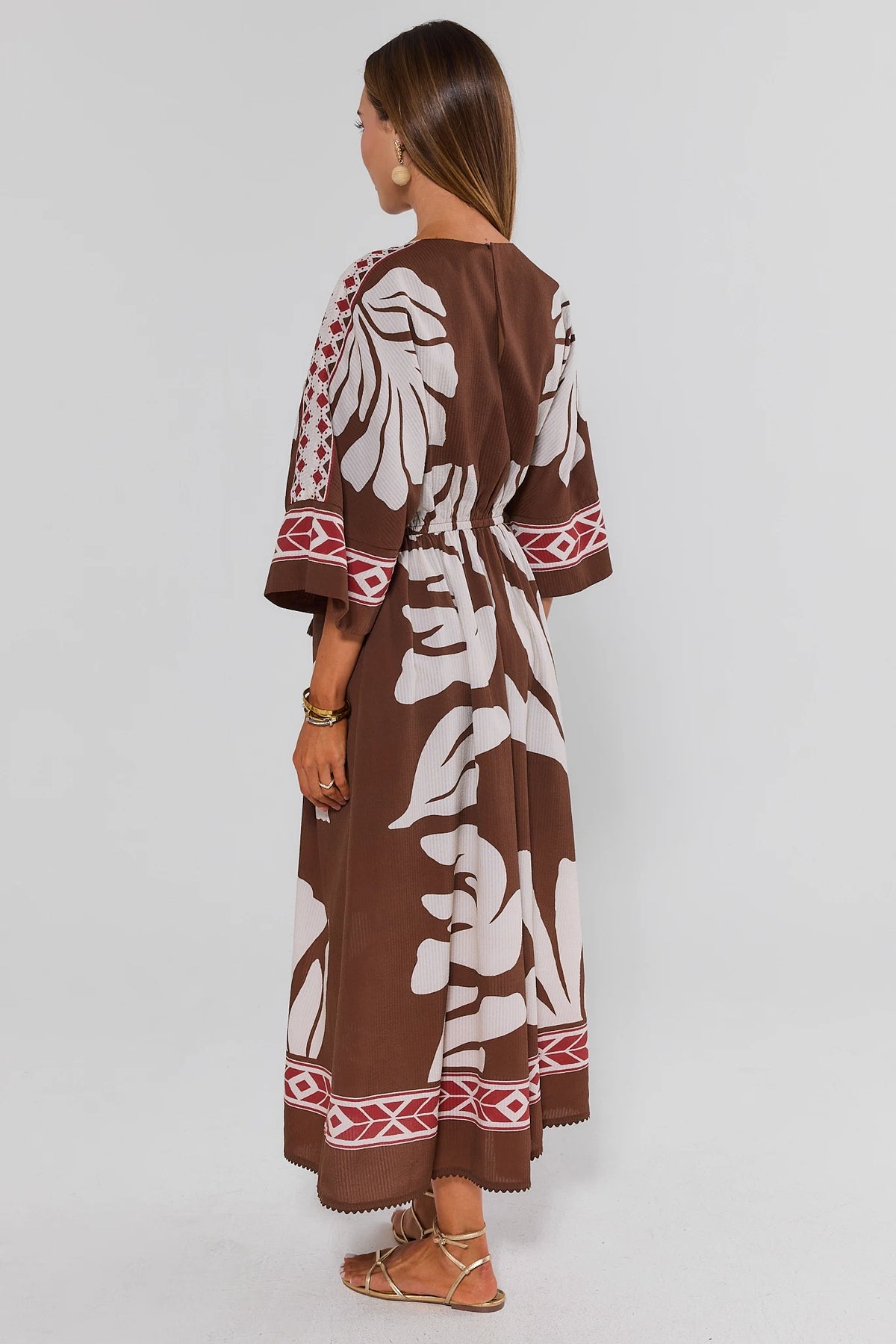 Brown Palm Print Maxi Dress flowy silhouette and border detail - Back View On Model | Avara