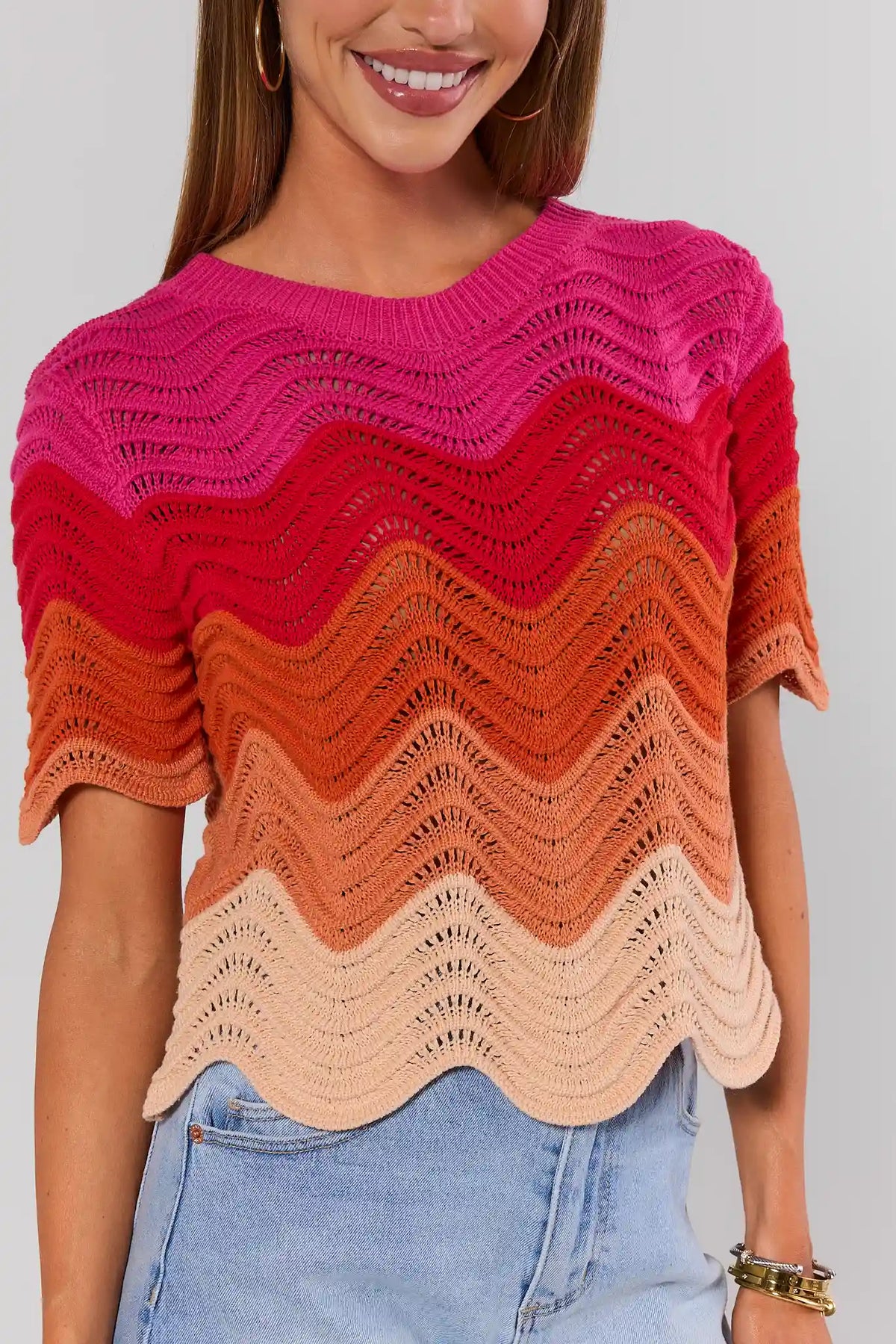 Pink to peach color block knit top with chevron wave texture and scalloped trim - Close-Up Detail | Avara