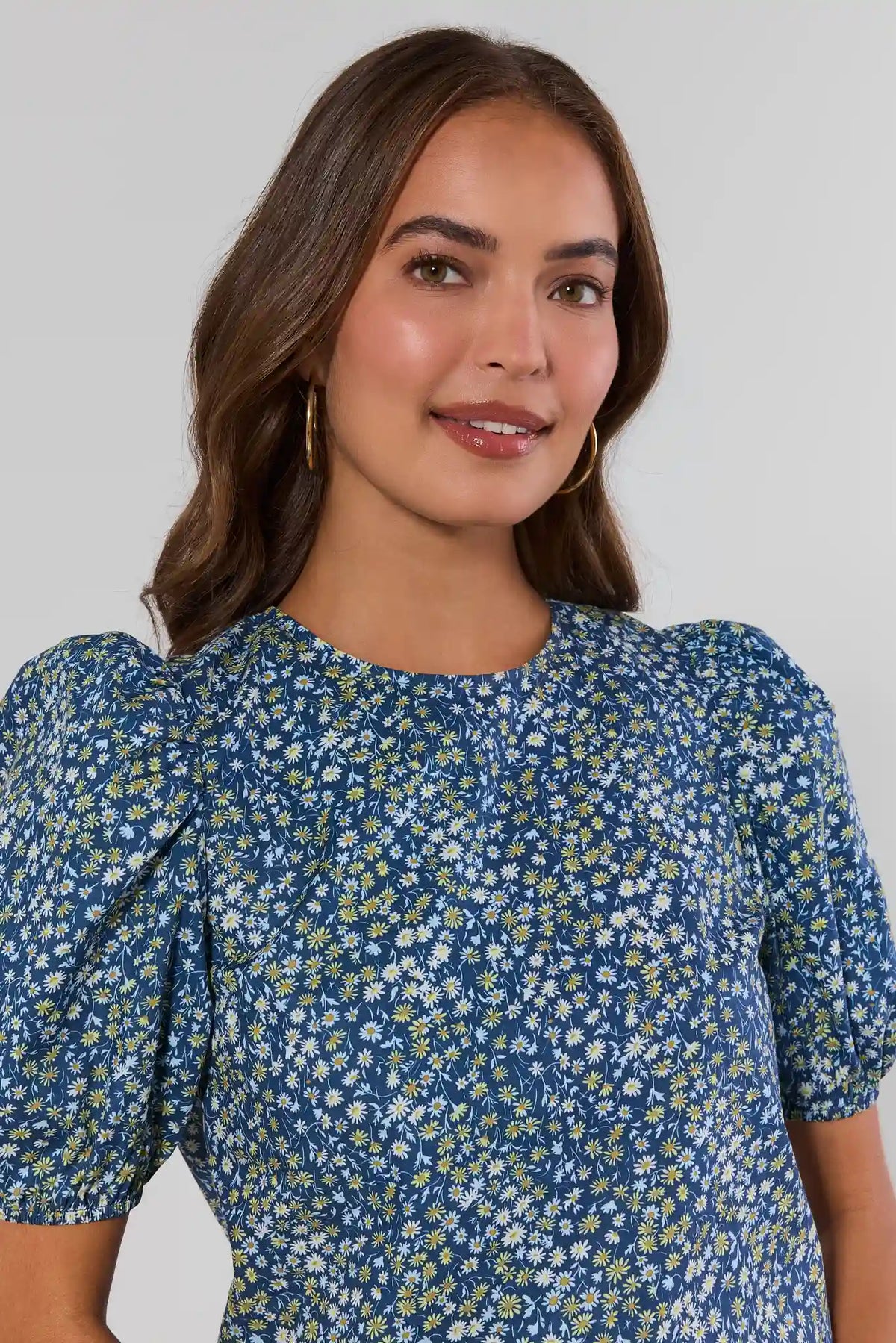 Victoria Navy Floral Print Top, ditsy daisy print with puff sleeves, front close-up on model | Avara