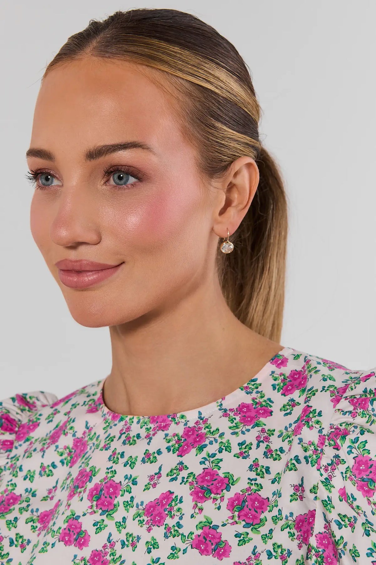 Gold Rhinestone Drop Earrings on model wearing pink floral dress - On Model Side View | Avara