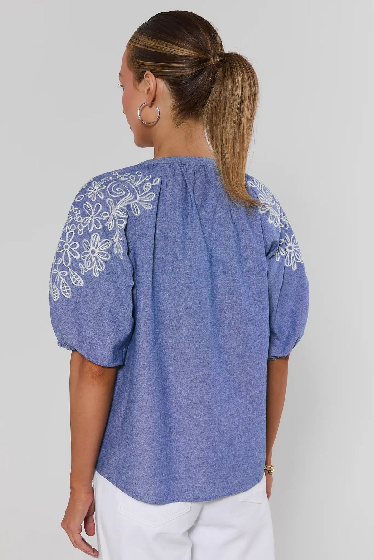 Laney Blue Embroidered Button Up Top - Back View, floral embroidery on shoulders, white pants | Avara