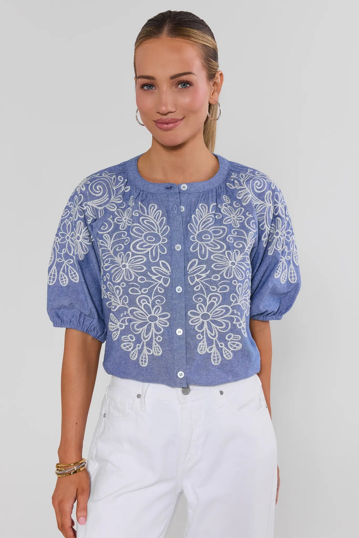 Laney Blue Embroidered Button Up Top - Front View, puff sleeves styled with white pants | Avara