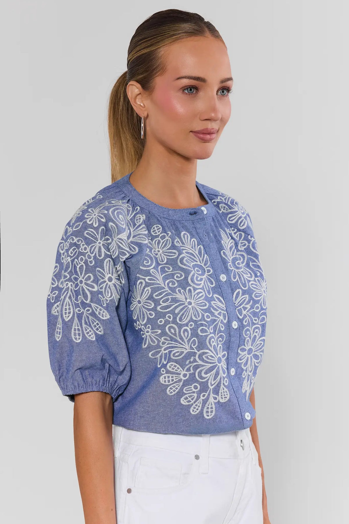 Laney Blue Embroidered Button Up Top - Side View, light blue embroidered top with puff sleeves | Avara