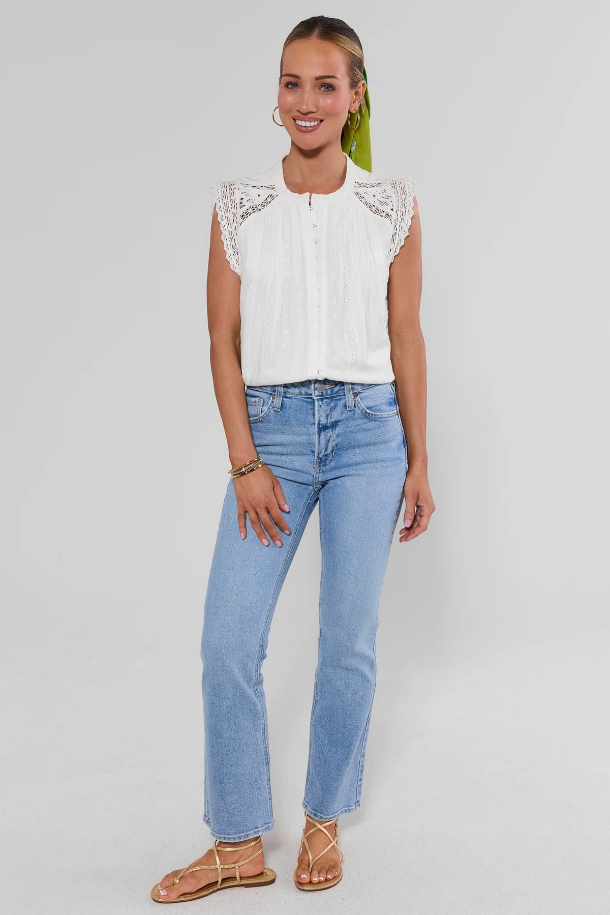 White eyelet embroidered top full-length styled look with jeans and green hair scarf - Front View | Avara