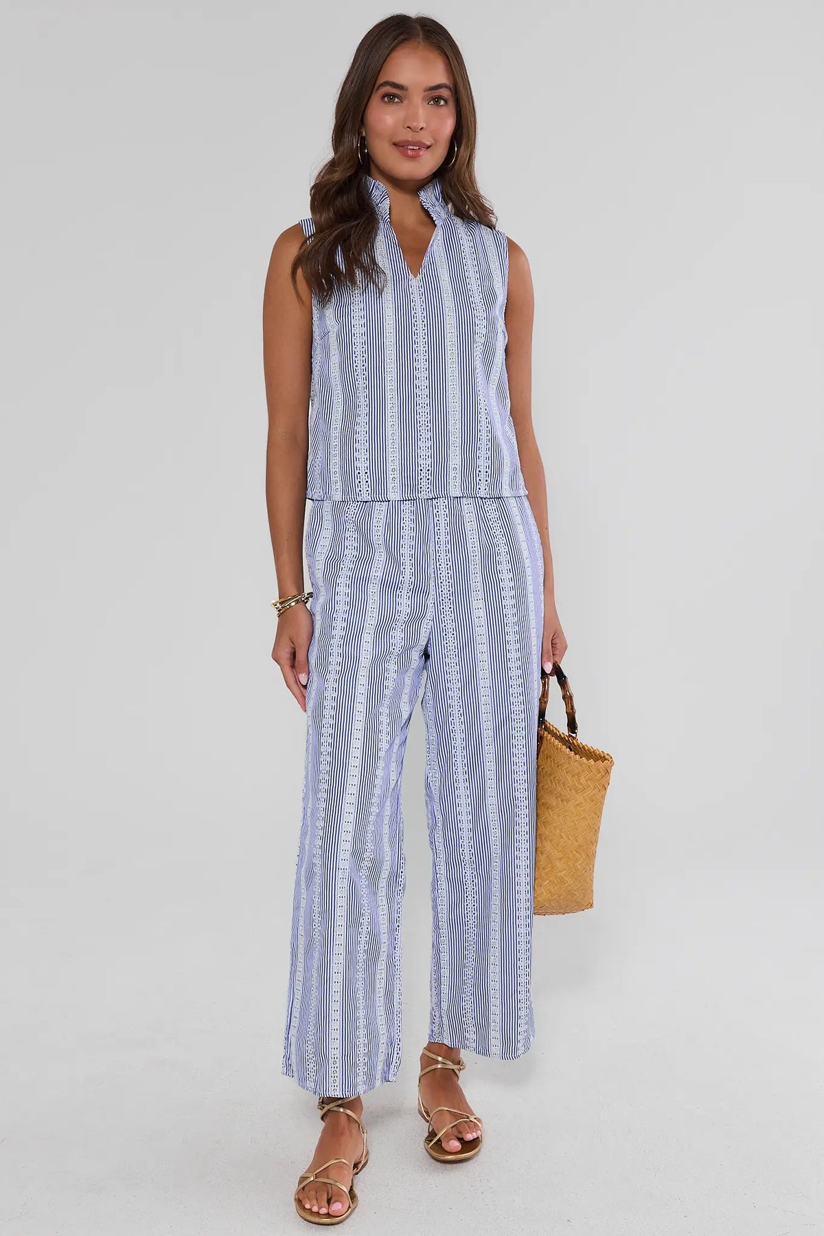 Blue stripe embroidered tank top matching set styled with woven bag and gold sandals - Full Body View | Avara