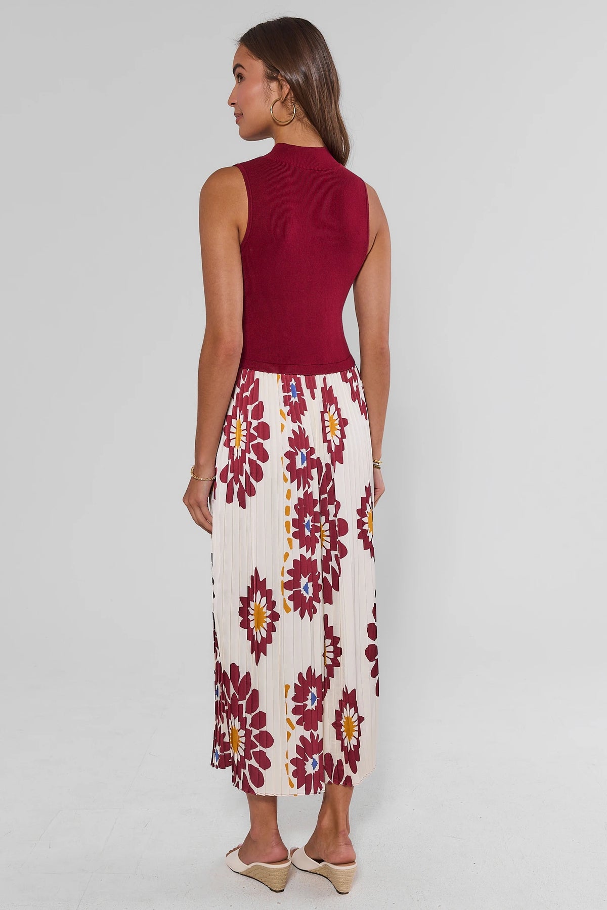 Back view of Marcia Burgundy Midi Dress showing ribbed sleeveless bodice and floral pleated midi skirt | Avara