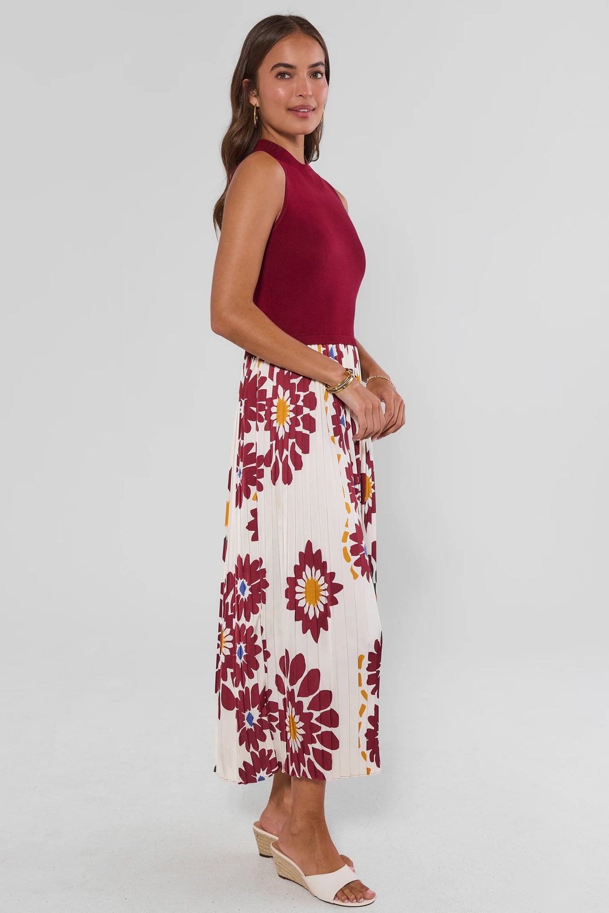 Side profile of Marcia Burgundy Midi Dress showing pleated floral skirt length and modest silhouette | Avara