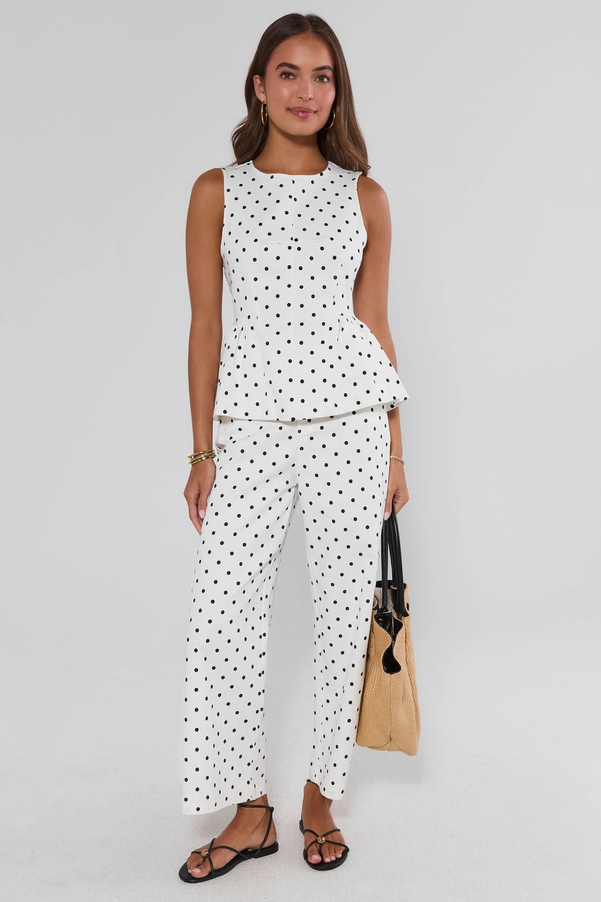 White black polka dot peplum tank top styled as matching set with wide-leg pants, full look | Avara