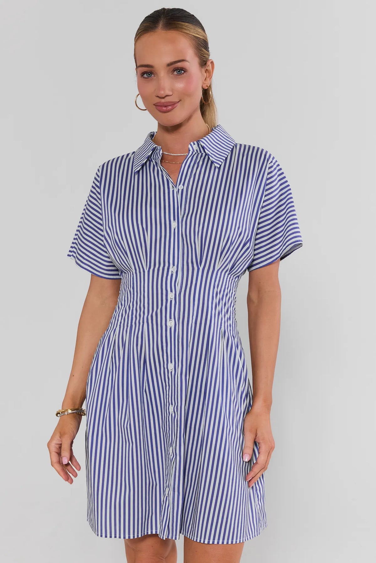 Olivia Blue Striped Button Up Short Dress - Front View, styled with gold sandals | Avara