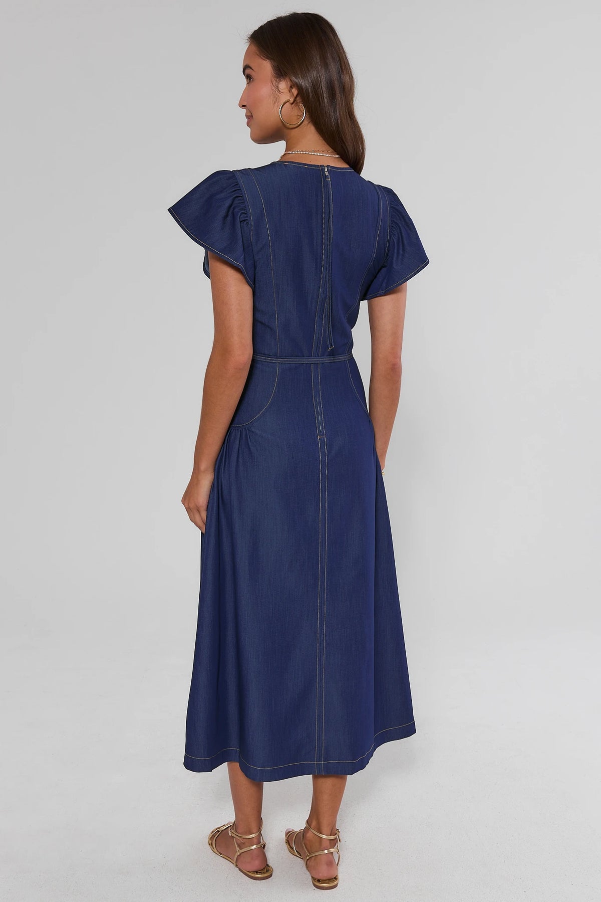 Dark blue denim flutter sleeve midi dress with back zip closure and A-line skirt - Back View | Avara
