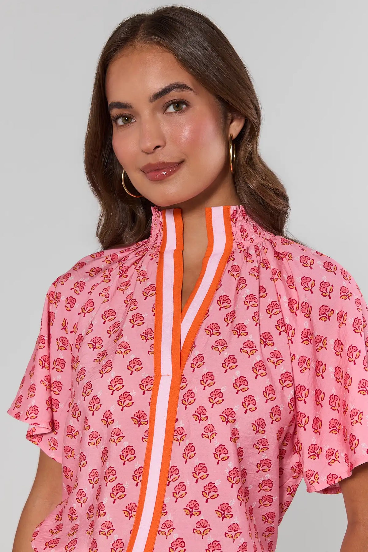 Pink floral THML top with orange stripe contrast trim neckline detail - Close-Up View | Avara