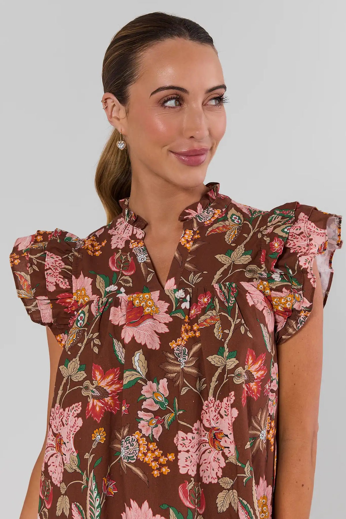 Romy Brown Floral Print Dress ruffle neckline and flutter sleeve close-up detail | Avara