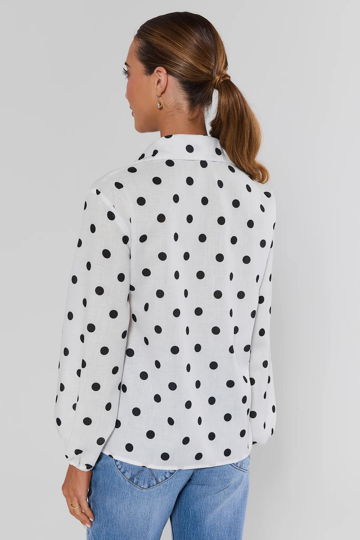 Cassidy White Polka Dot Button-Up Top with long sleeves styled with jeans - Back View | Avara