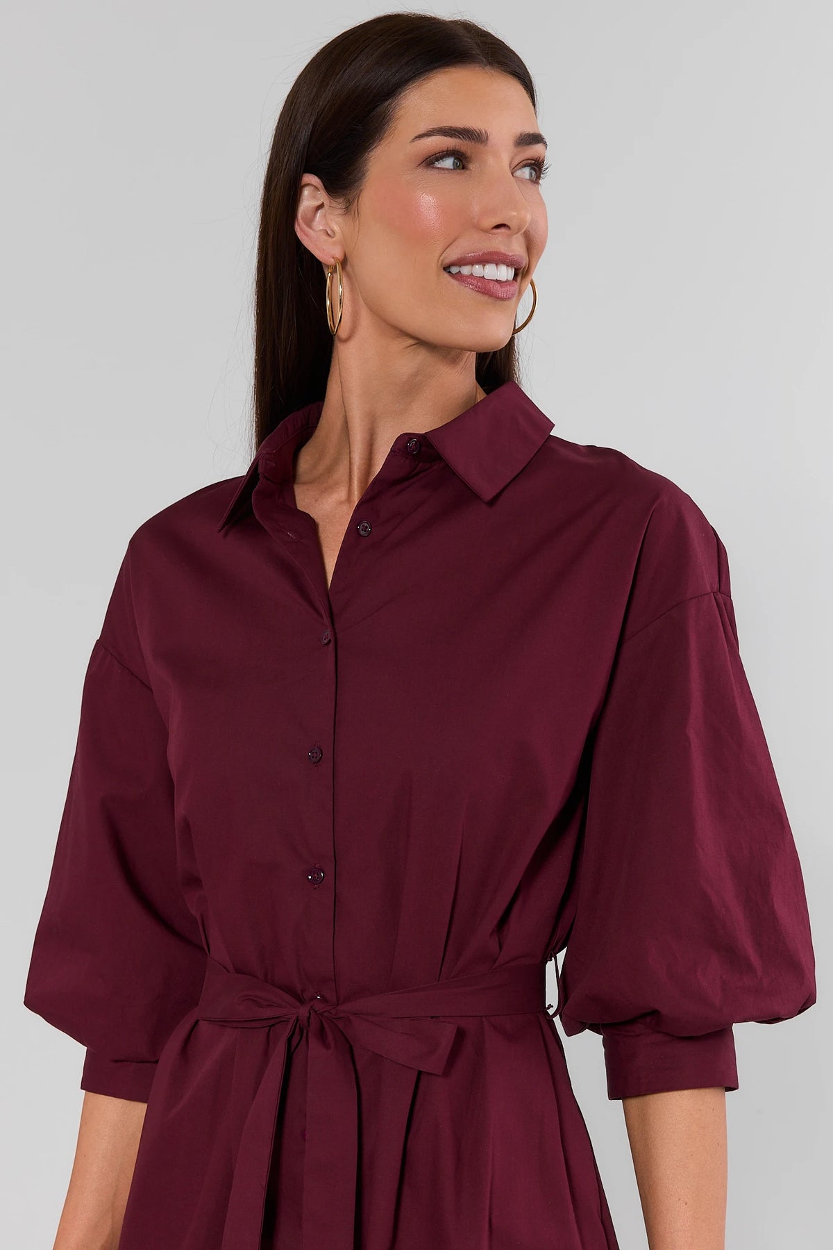 Summerlyn Burgundy Midi Dress - close-up detail of collared neckline, button-front placket, and three-quarter puff sleeves | Avara