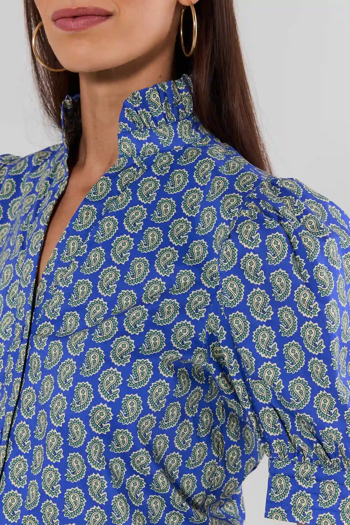 Close-up of Gracie Blue Paisley Print Top showing green paisley pattern and ruffle neckline detail | Avara