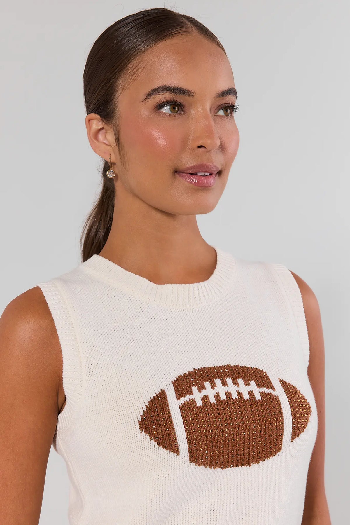 AJ White Football Sleeveless Knit Top close-up detail of rhinestone football graphic and crew neckline | Avara