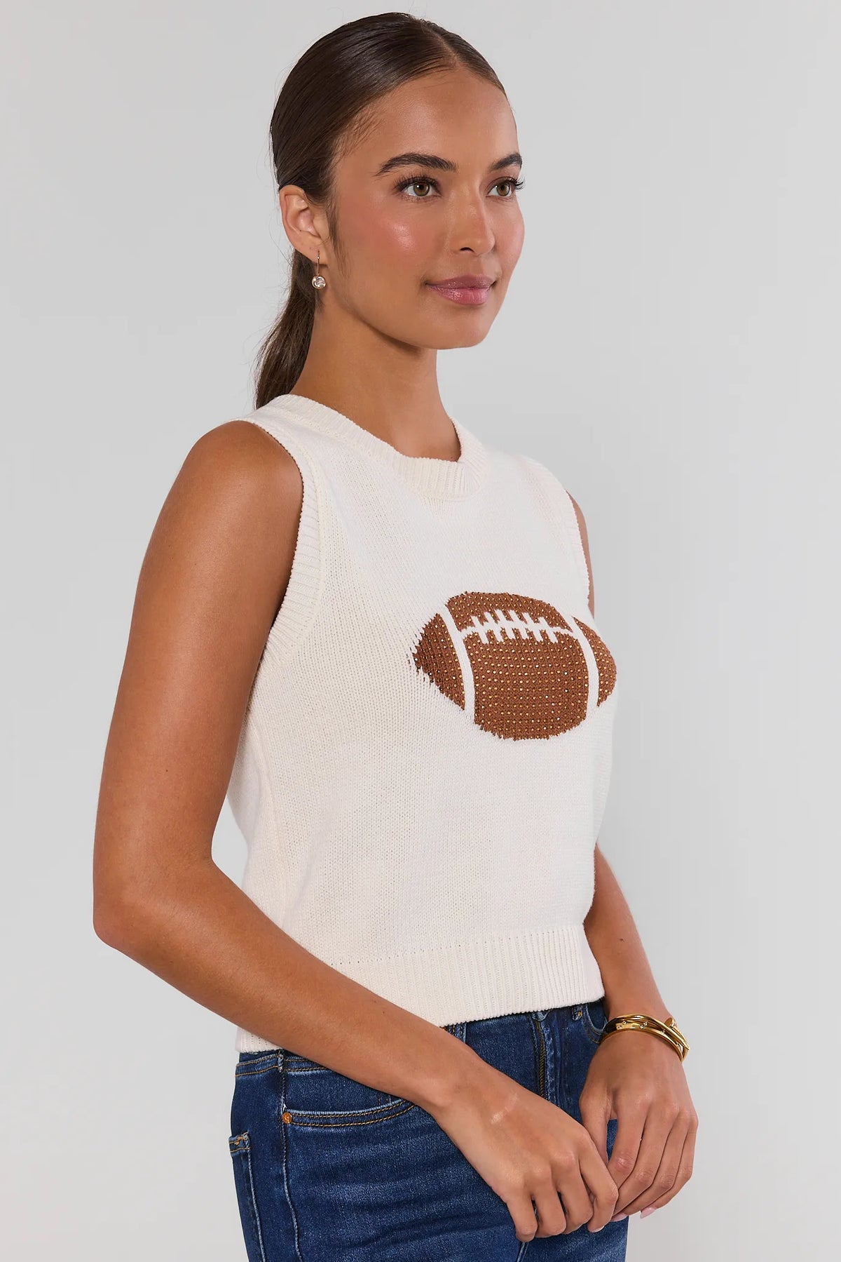 AJ White Football Knit Top side profile view showing sleeveless silhouette and ribbed hem on model | Avara