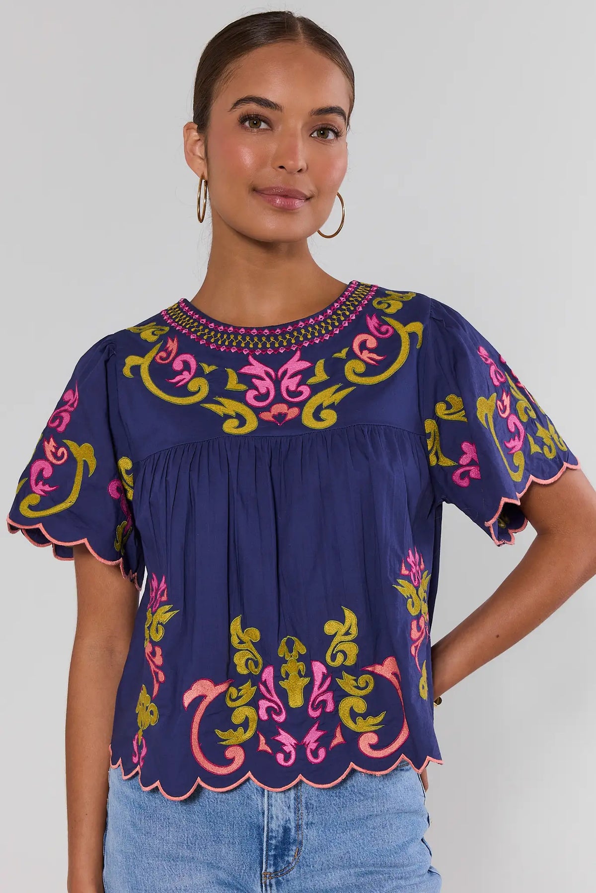 Navy embroidered scalloped top by THML with pink and gold scroll embroidery, front view on model | Avara