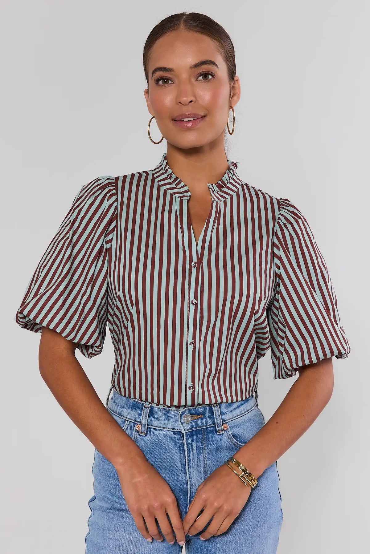 Brown & mint stripe button-up top by THML, puff sleeves & ruffle neck, styled with jeans - Front View | Avara