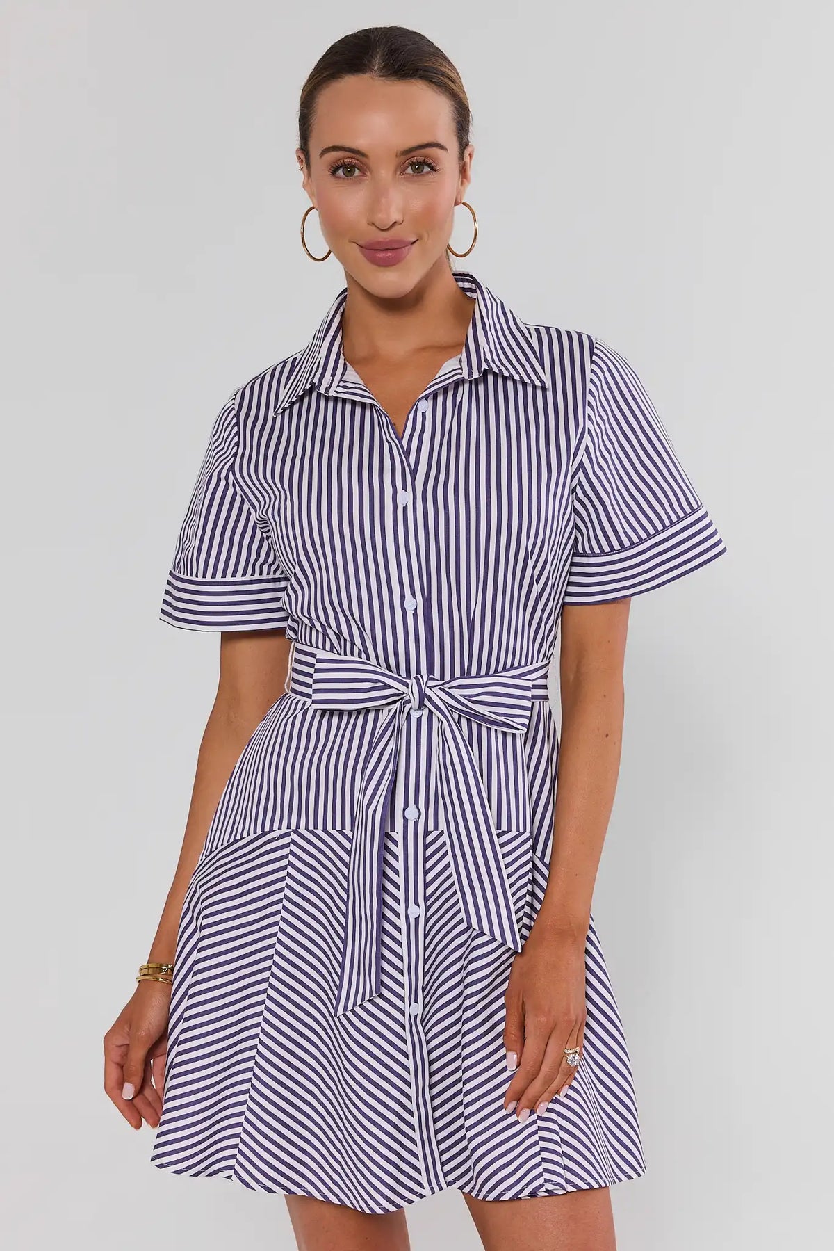 Millie Purple Striped Short Dress - Front View, short-sleeve button-down shirt dress with flared skirt, styled with sneakers | Avara