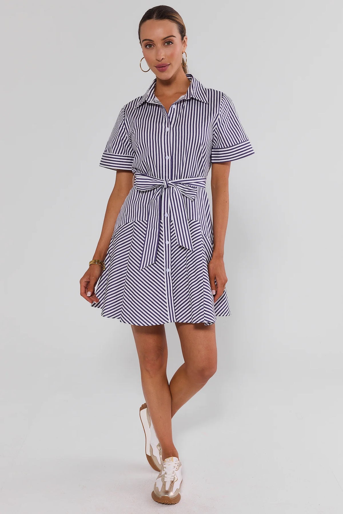 Millie Purple and White Striped Short Dress - Walking Front View, tie-waist collared shirt dress with flared hem | Avara