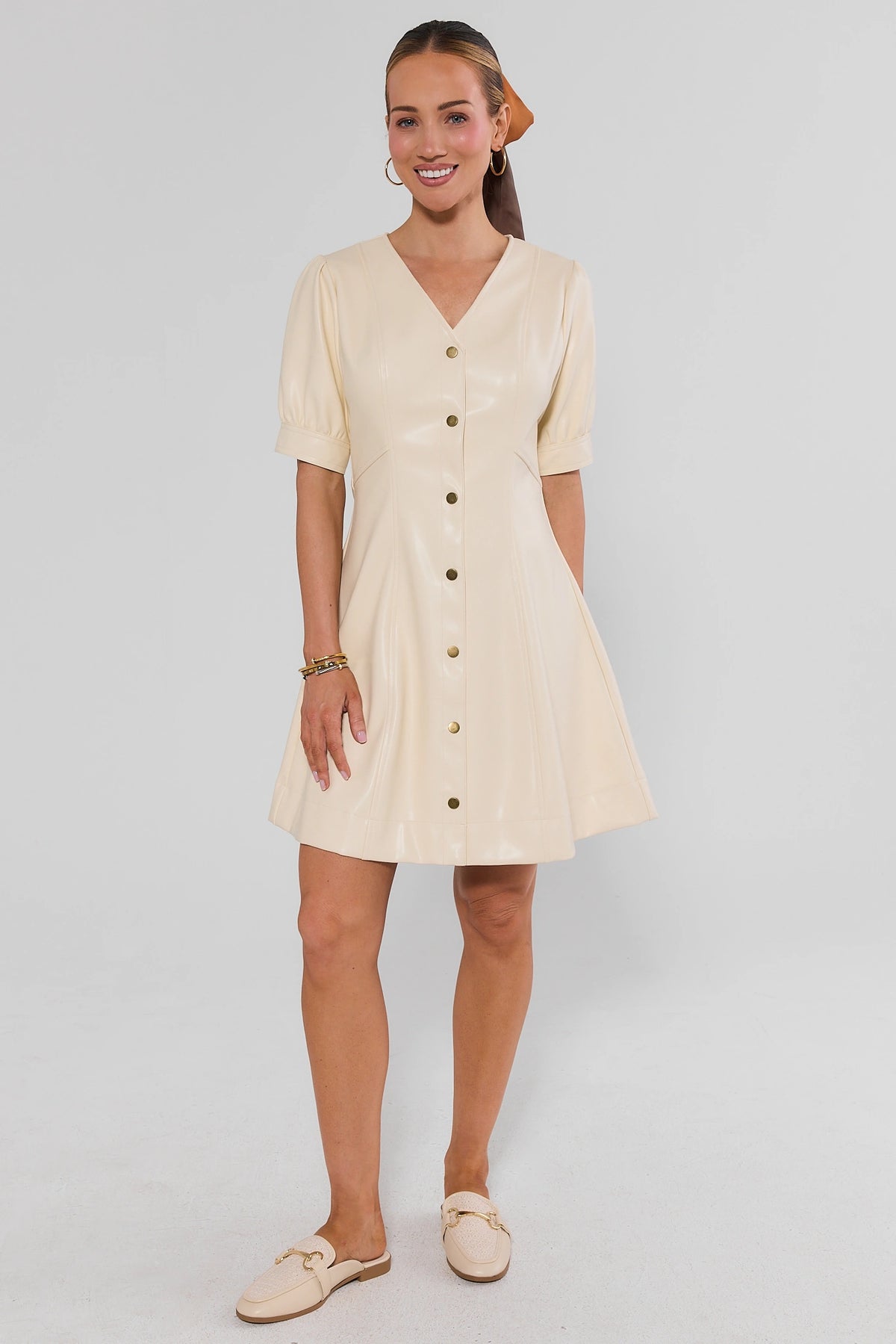 Woman wearing Ivory Faux Leather Short Dress with hair scarf and ivory mule slides - Full Length Front | Avara