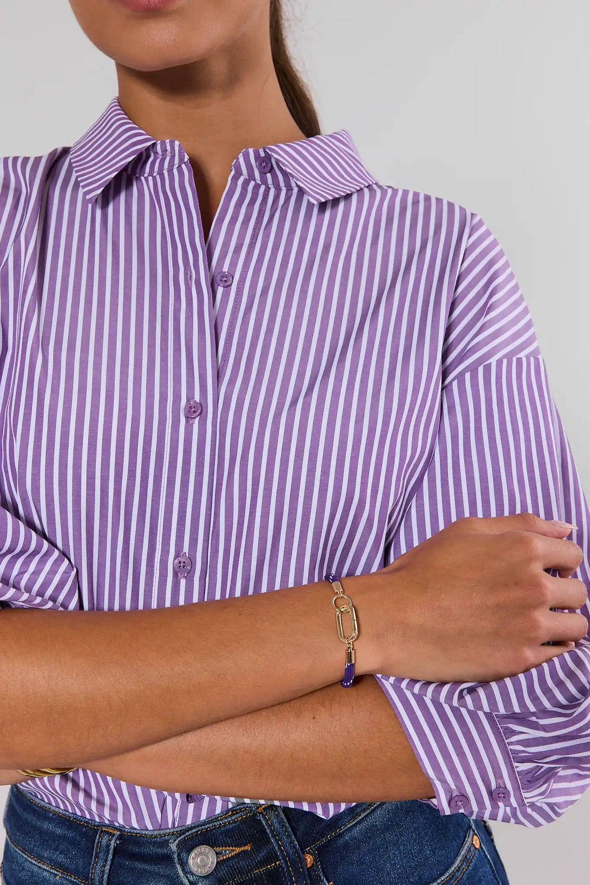 Women's purple cord carabiner bracelet styled on wrist with striped shirt - On Model Detail | Avara