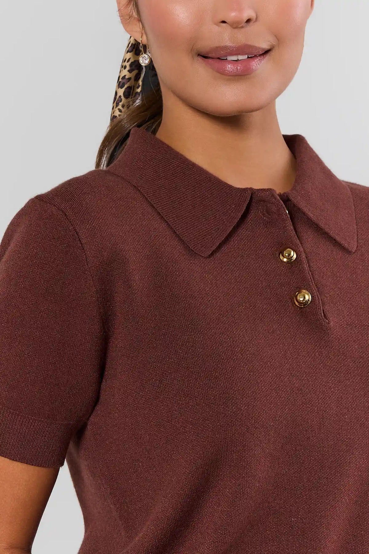 Ada Brown Knit Short Sleeve Top polo collar and gold-tone button detail close-up - Fabric Detail | Avara