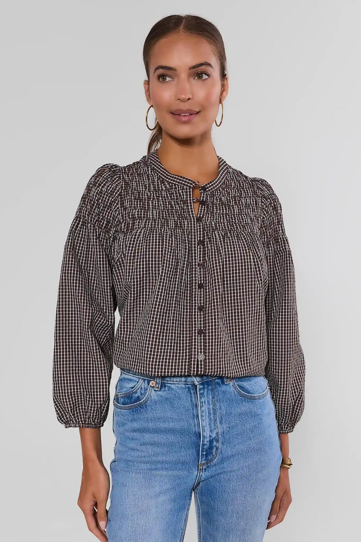 Reese Brown Windowpane Plaid Smocked Top - Front View, modest long-sleeve blouse with smocked yoke and button front, styled with jeans | Avara