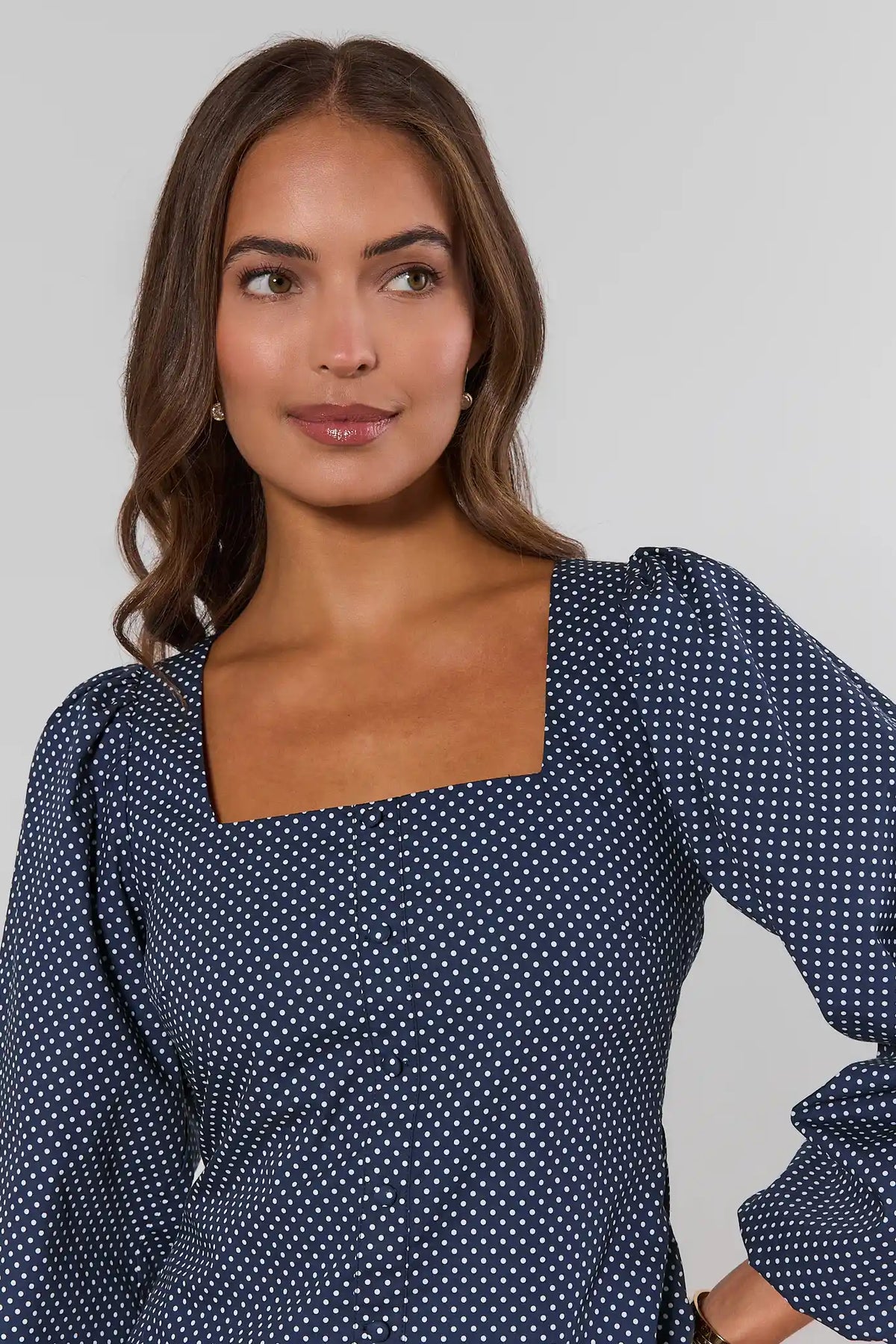 Navy white polka dot square neck top, neckline close-up detail showing puff sleeves and button front | Avara