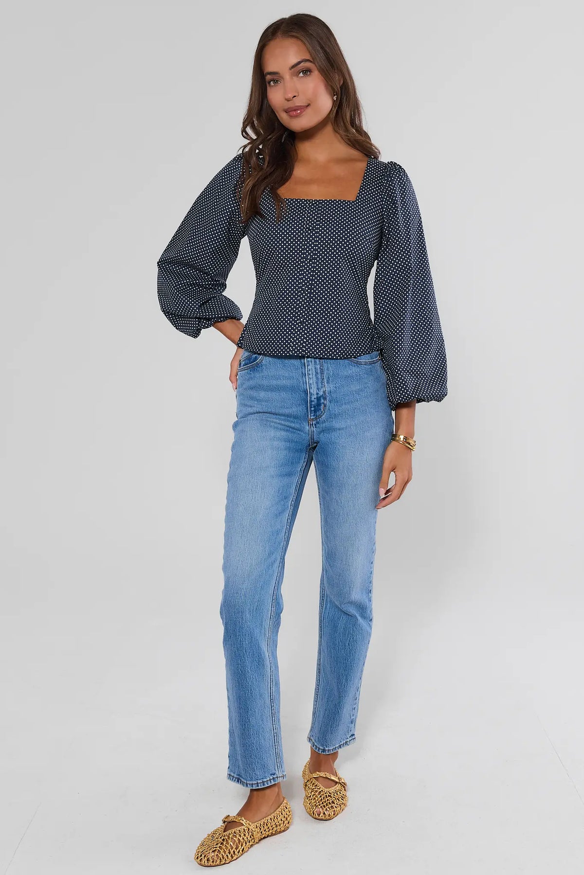 Navy polka dot square neck top full-length front view styled with straight-leg jeans and woven flats | Avara