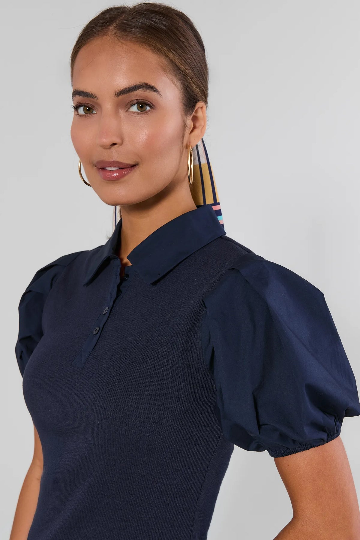 Navy Collared Polo Top close-up detail showing polo neckline, puff sleeves, and button placket | Avara