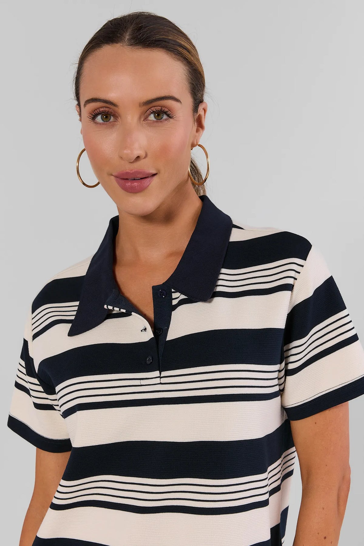Navy Stripe Collared Short Dress close-up detail showing polo collar and button placket, gold hoop earrings | Avara