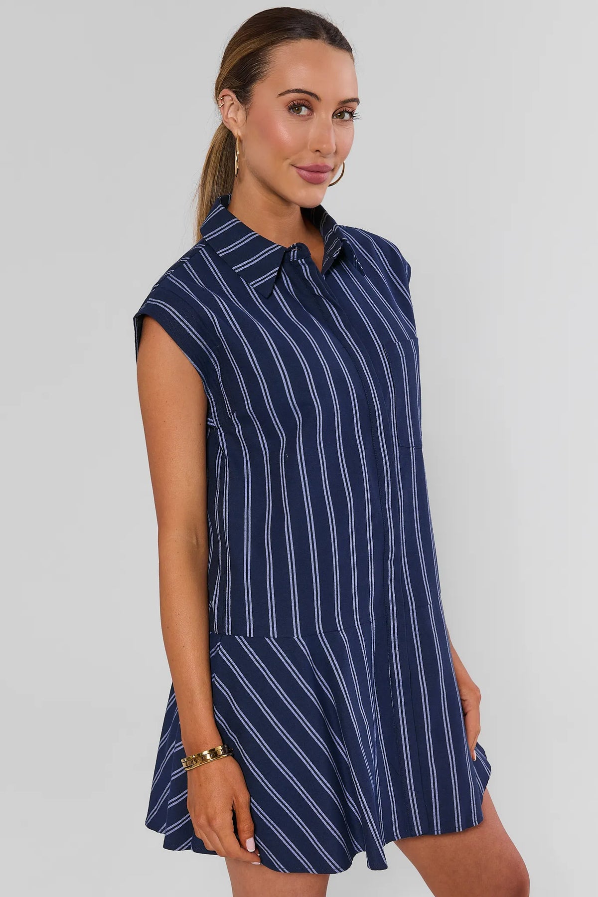 Navy white striped drop-waist shirt dress with flared skirt, side angle view - Eliana by English Factory | Avara