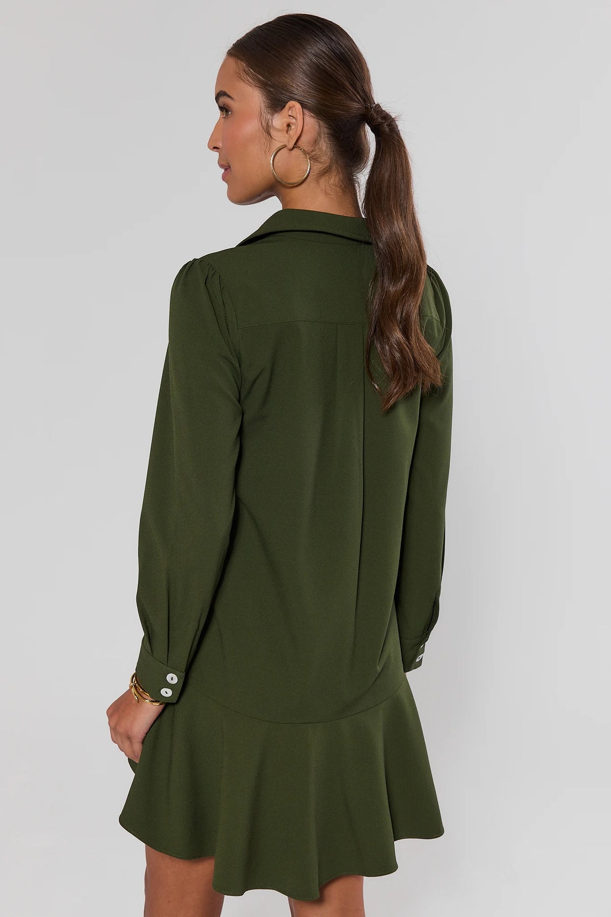 Olive Meagan Drop Waist Dress - Back View showing flounce hem and long-sleeve button cuffs | Avara