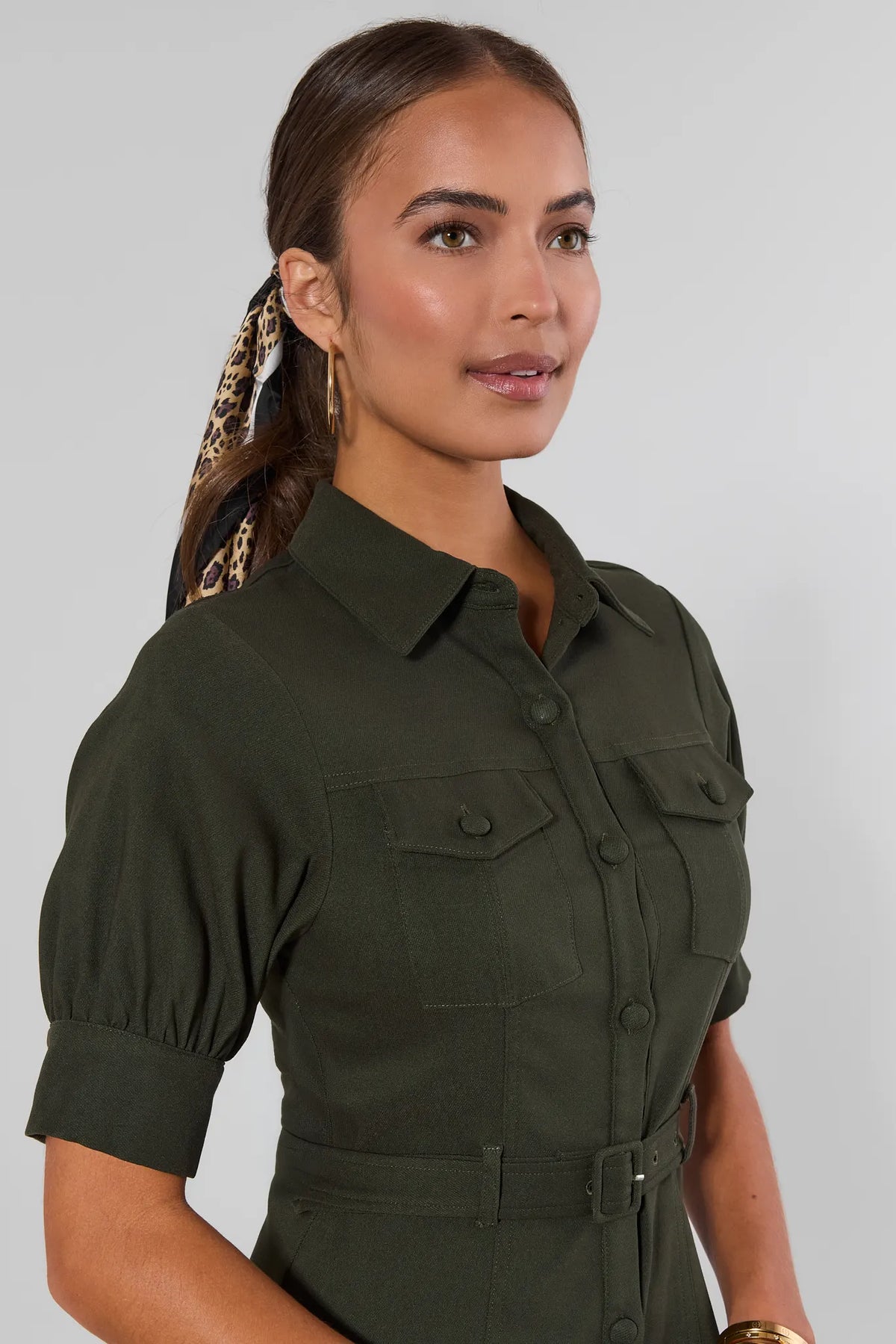 Olive green belted button-up short dress with puff sleeves and chest pockets - Side Detail View | Avara