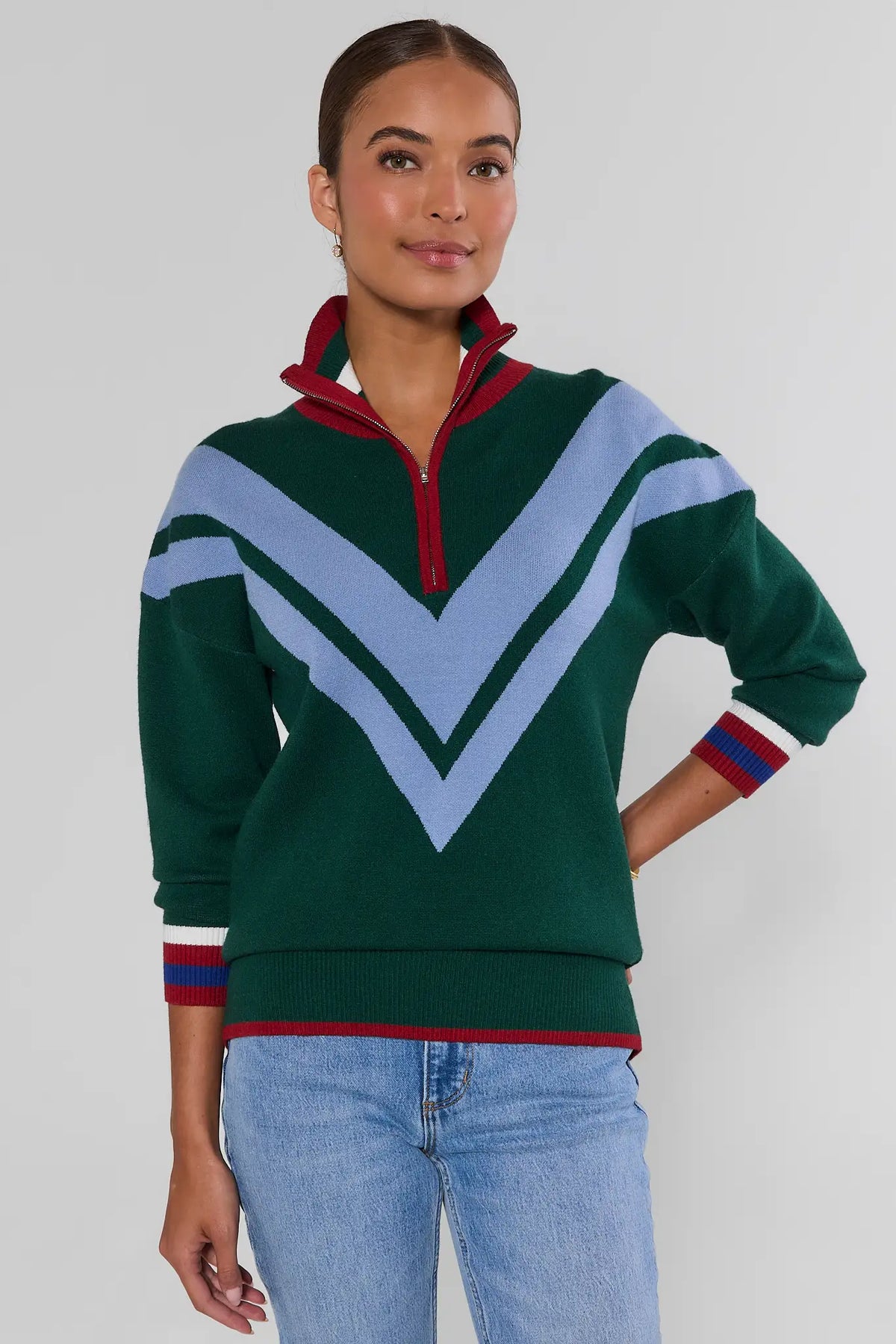 Collin Green Knit Zip Up Sweater colorblock chevron and red zip collar, styled with jeans - Three-Quarter Side View | Avara
