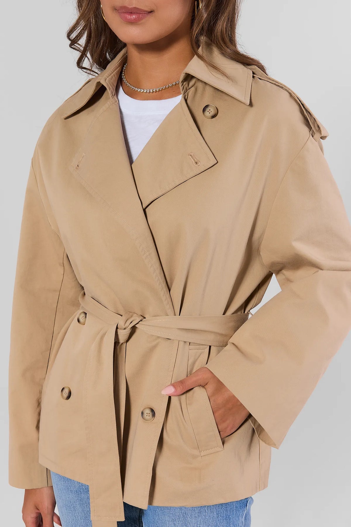 Tan Short Trench Coat - Belted Waist, Double-Button, and Notch Collar Close-Up Detail | Avara