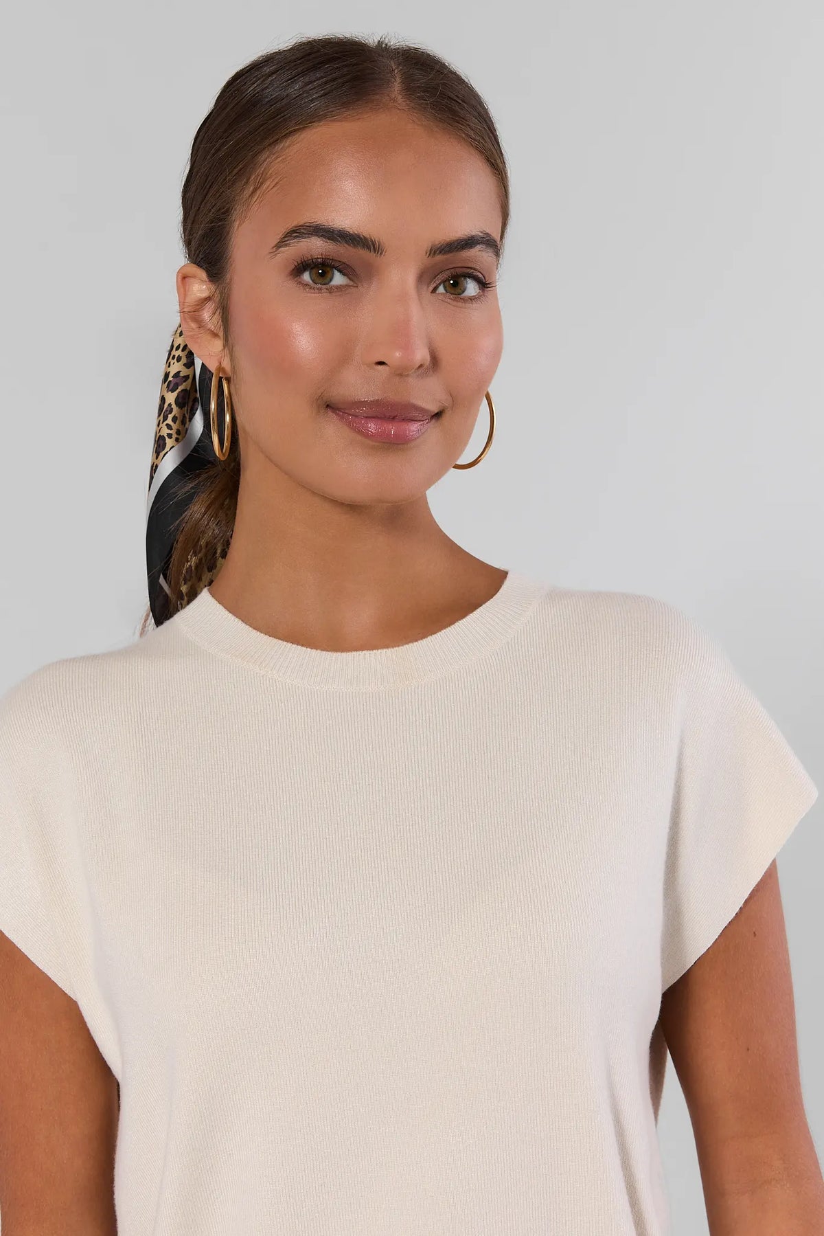 Ivory Knit Crewneck Top close-up detail, crew neckline and soft knit texture, gold hoops | Avara