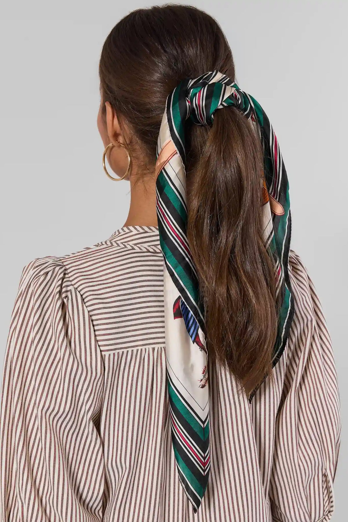 Green Trim Horse Scarf tied in hair as ponytail wrap - Back View, green stripe border on model | Avara