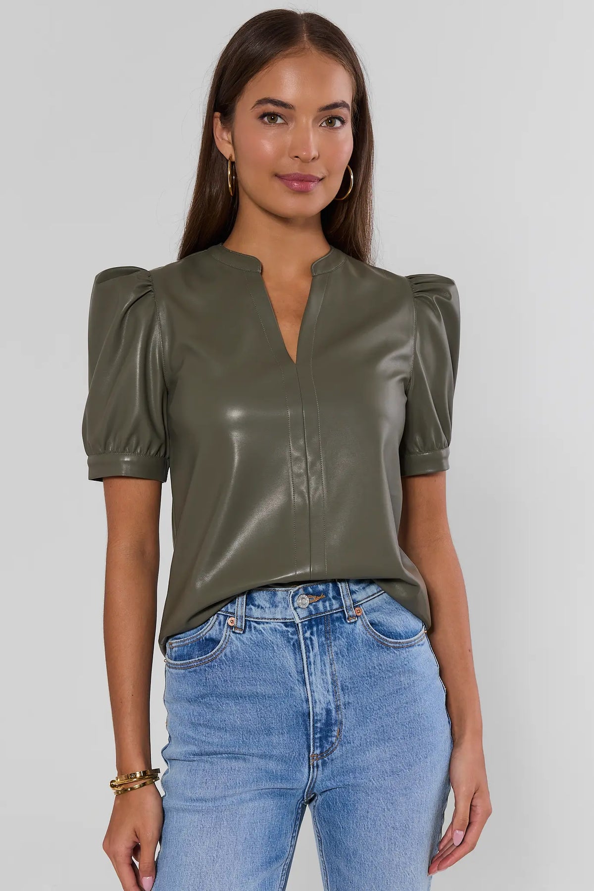 Olive Faux Leather Split Neck Puff Sleeve Top - Front View On Model with Jeans | Avara