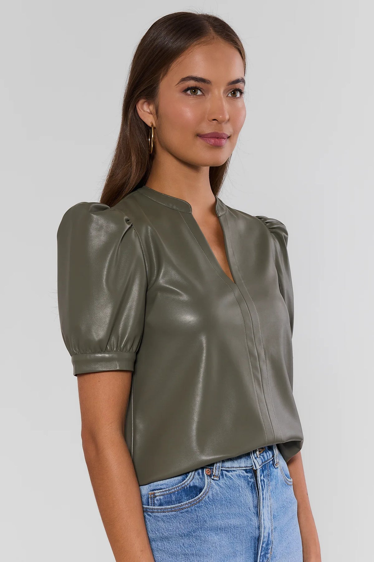Olive Faux Leather Split Neck Puff Sleeve Top - Three-Quarter Side Angle On Model | Avara