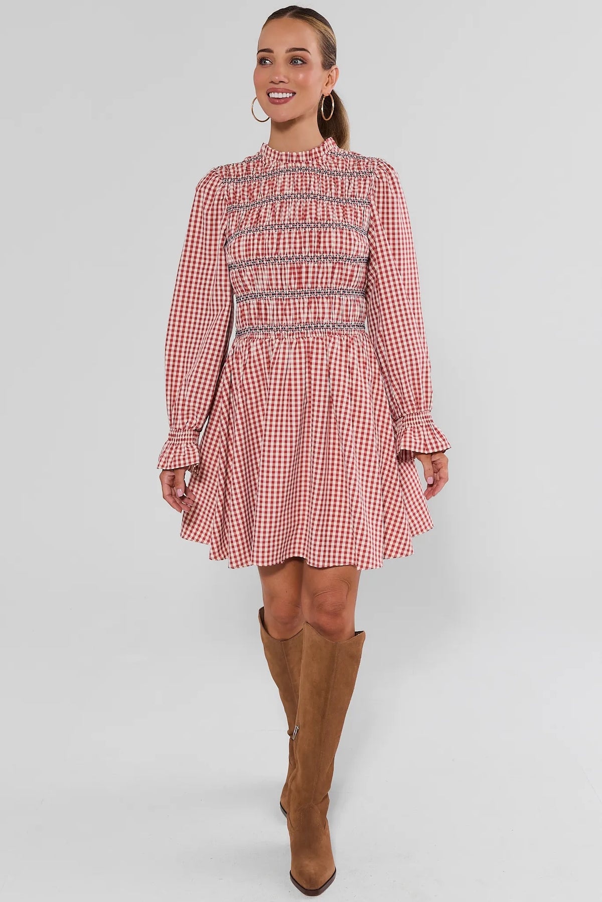 Red Gingham Smocked Short Dress - Front View On Model with Boots | Avara