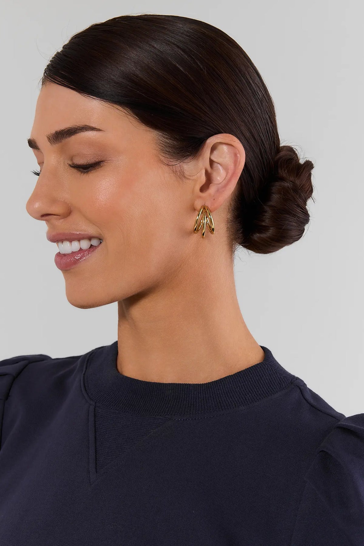 Gold Stacked Hoop Earrings On Model - Side Profile Close-Up | Avara