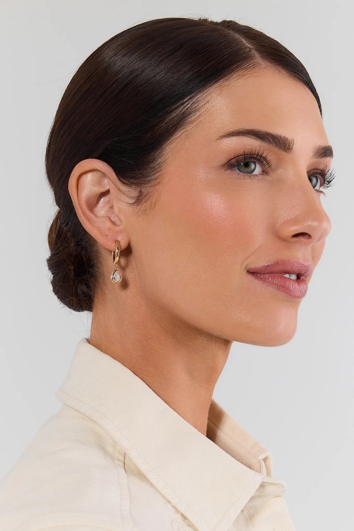 Gold Rhinestone Huggie Hoop Earrings - On Model Side Profile | Avara