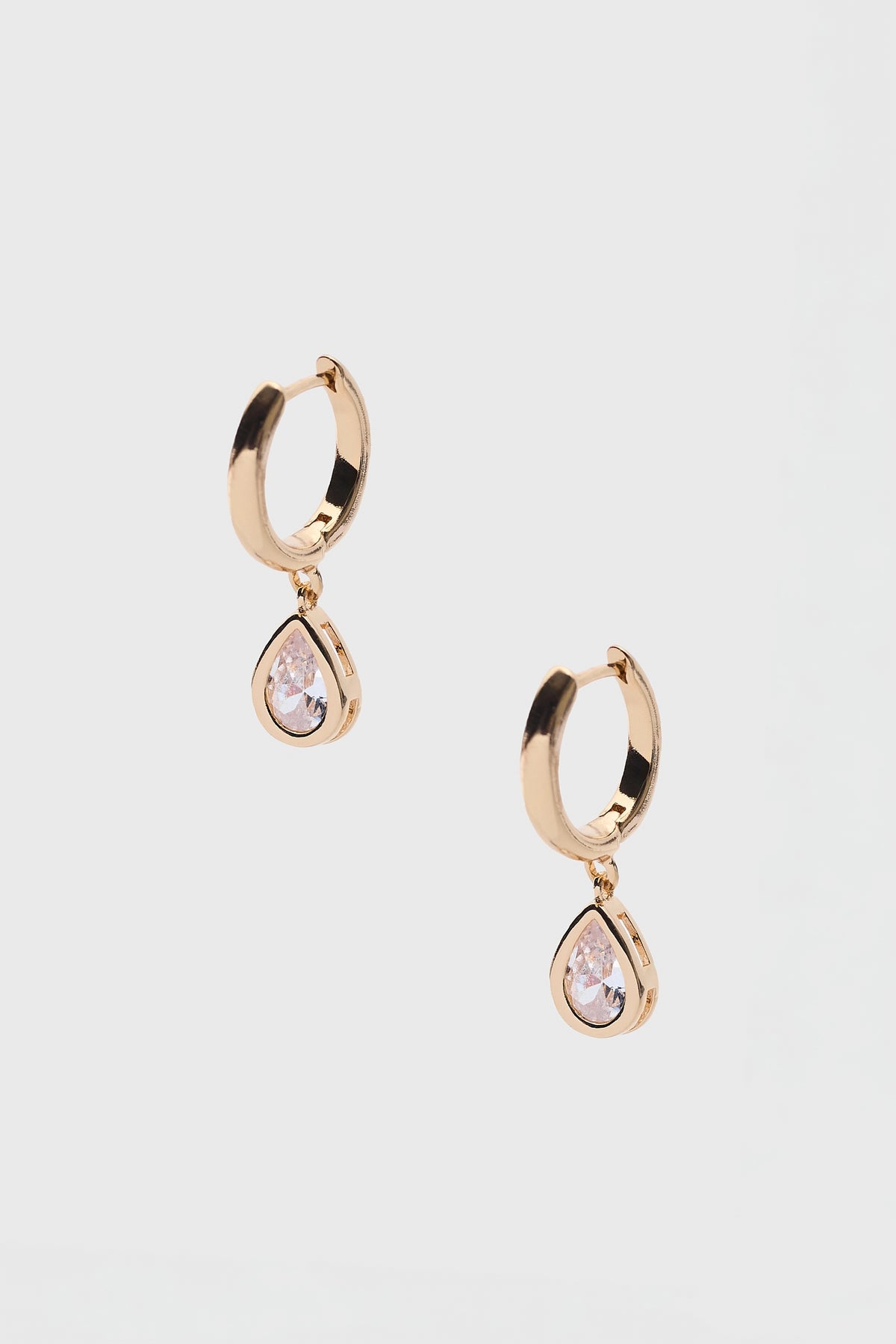Gold Teardrop Rhinestone Huggie Earrings - Product Flat Lay | Avara